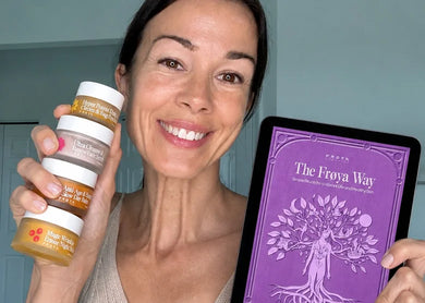 Woman holding Frøya Organics products and The Frøya Way ebook
