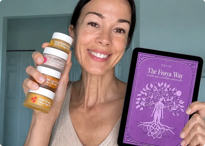 Woman holding Frøya Organics products and The Frøya Way ebook