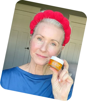 Woman smiling with Frøya Organics balm